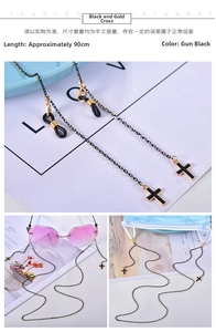 Detail of gunmetal chain and black cross pendant for glasses or mask straps