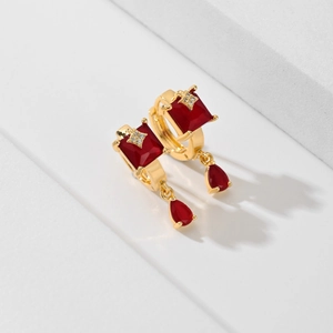 Fashionable gold plated earrings with red square stones and teardrop pendants