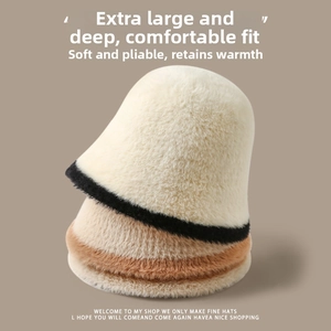 Detail of plush bucket hats stacked showing soft faux fur texture and warm thermal lining