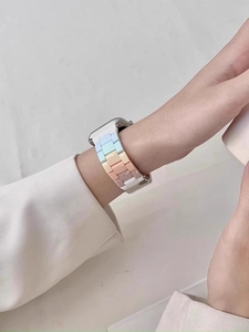 Detail of macaron-colored resin watch band on wrist for Apple Watch series