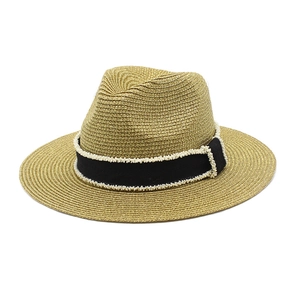 Golden straw Panama hat with black beaded ribbon band for summer beach sun protection