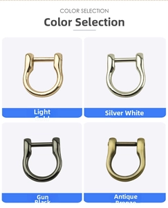 Detail view of four polished zinc alloy D-ring buckles in gold, silver, gunmetal, and bronze