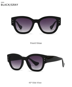 Detail view of oval sunglasses with black frames, purple gradient lenses and silver accents
