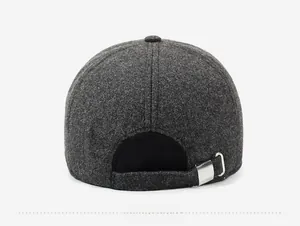 Detail view of the back of a dark gray wool baseball cap with an adjustable metal buckle