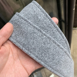 Detailed macro view of heather grey wool fabric belt with premium stitched edges