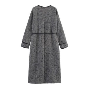 Back view of women's long tweed coat with black leather trim and herringbone pattern