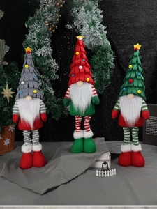 Three plush Christmas gnomes with telescopic long legs in red, green and grey colors