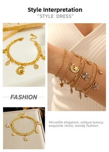 Detailed view of layered gold-plated stainless steel bracelets with star and moon charms