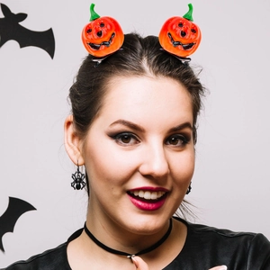 Set of two funny orange pumpkin hair clips with cute smiling faces for Halloween party styling