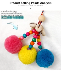 Detailed view of handmade bohemian bag charm with colorful pom poms and natural shells