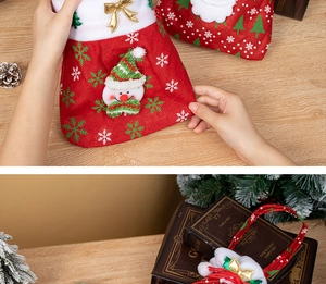 Close-up of festive red burlap Santa gift bag with plush trim and 3D snowman detail