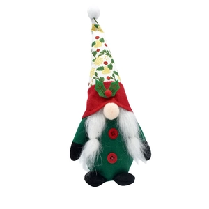 Detail of a Christmas gnome with a patterned pointed hat and fluffy white beard