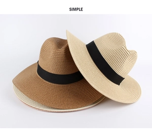 Detail of woven straw texture and black ribbon band on dark brown and beige sun hats