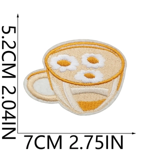 Detail showing embroidered daisy coffee cup patch with dimension 5.2x7cm on white base