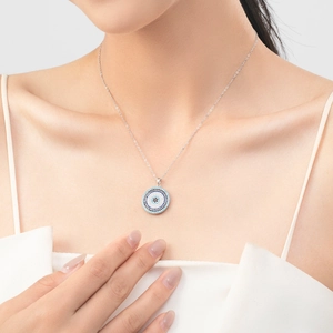 Elegant s925 silver necklace with turquoise evil eye pendant on model's neck