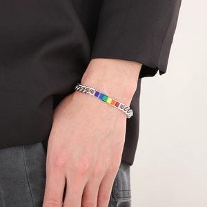 Detail of silver Cuban chain bracelet featuring vibrant rainbow block inlay on wrist