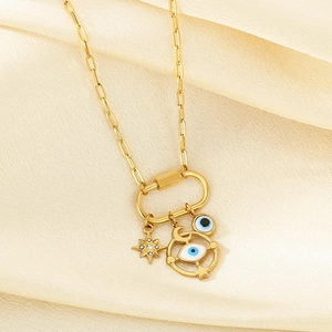 Celestial evil eye necklace with star and moon charms on gold paperclip chain