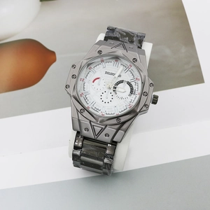 Macro side view showing the polygonal gunmetal watch case with triple subdials and metal strap