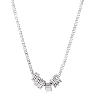 Close-up of punk style silver chain necklace with rivet cross and rhinestone pendants