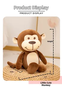 Detailed view of the cute plush monkey showing height and width dimensions on a woven stool