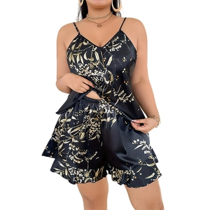 Floral print satin pajama set featuring V-neck camisole and ruffled shorts in black