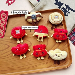 Plush Chinese New Year fortune bag and gold ingot brooch with Fu embroidery detail