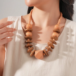 Detail of wooden beads and geometric pendant on ethnic style choker necklace