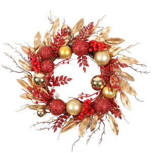 Christmas wreath with red and gold ornaments, berries, and foliage on a natural branch base