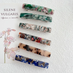 Set of 6 rectangular acetate hair clips in assorted marble and tortoise patterns