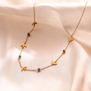 18K gold plated titanium steel necklace with blue evil eye beads and swallow pendants