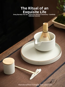 Japanese matcha tea whisk set with ripple ceramic bowl, bamboo whisk and tray on wooden table