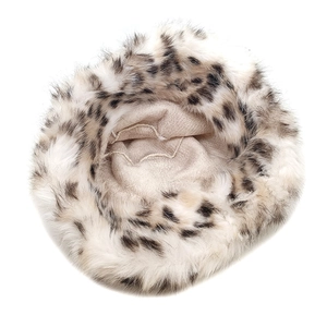 Macro view of leopard print faux fur bucket hat with soft lining and warm plush texture