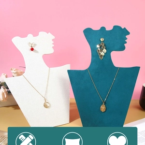Minimalist portrait silhouette jewelry stand showing necklace and earring details