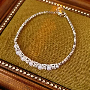 Elegant silver pearl zircon chain bracelet for women on green velvet display tray
