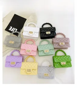 Close-up of colorful jelly bags with quilted patterns and stylish beaded handles
