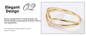 Macro detail of V-shaped gold plated ring featuring delicate micro-set cubic zirconia