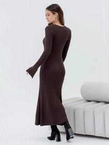 Brown Hepburn style knit midi dress with heart cutout and flared sleeves on model
