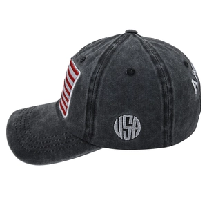 Close-up of USA embroidery and flag patch on washed denim baseball cap in charcoal gray