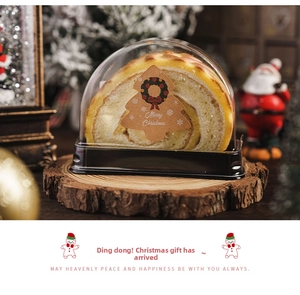 Close-up of Christmas tree sealing sticker on a dessert box with festive decorations
