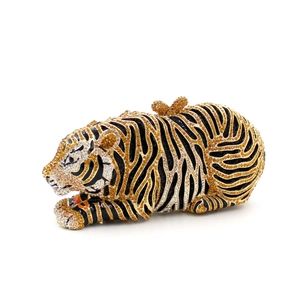 Detailed close-up of crystal-encrusted tiger evening clutch bag with sparkling rhinestones
