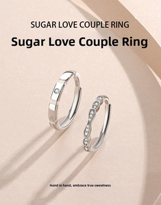 Detail of S925 sterling silver couple rings showing geometric blocks and wave pattern