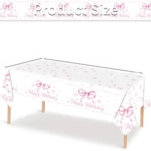Detailed view of pink bow birthday tablecloth measuring 130x220cm for girls' parties
