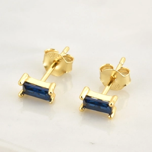 Macro view of S925 sterling silver earrings with blue rectangular zircon and hallmark