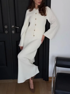 Women's cream white knit two-piece set featuring button-up cardigan and long skirt