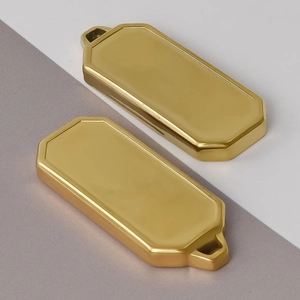 Detailed view of two gold rectangular stainless steel pendants for DIY jewelry design