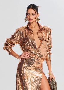 Elegant rose gold sequin two-piece set featuring long sleeve shirt and high slit maxi skirt