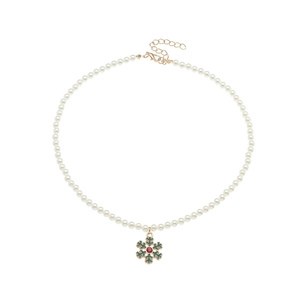 Macro detail of Christmas pearl necklace with green snowflake pendant and adjustable clasp