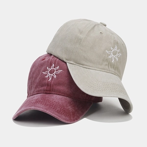 Washed vintage baseball caps with sun embroidery in burgundy and beige colors