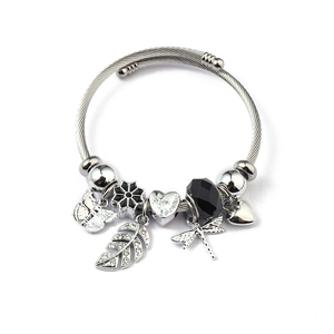 Detail of silver twisted cable bracelet with heart charms and butterfly pendants