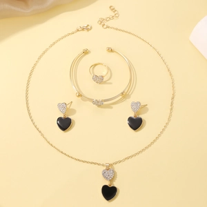 Exaggerated gold-tone jewelry set with double heart crystal and black enamel charms
